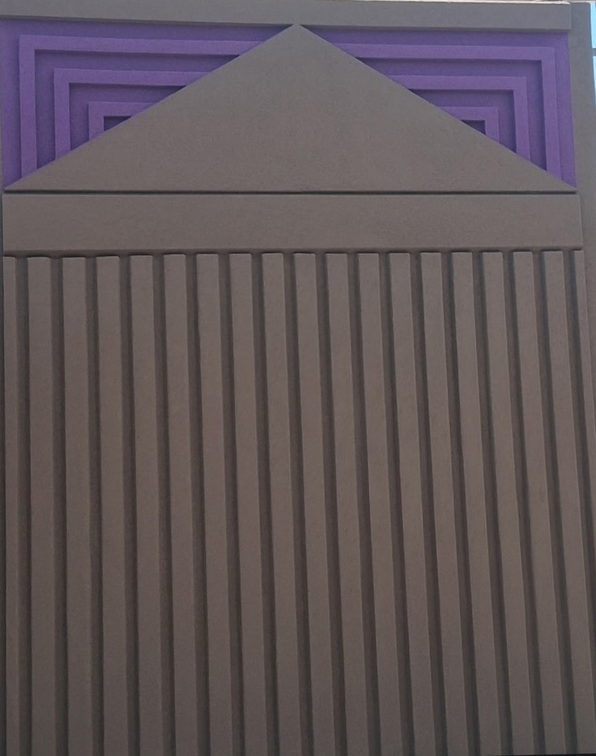 Arizona DOT Infinity Wall panel pairing a purple geometric triangle pattern with a brown fluted finish